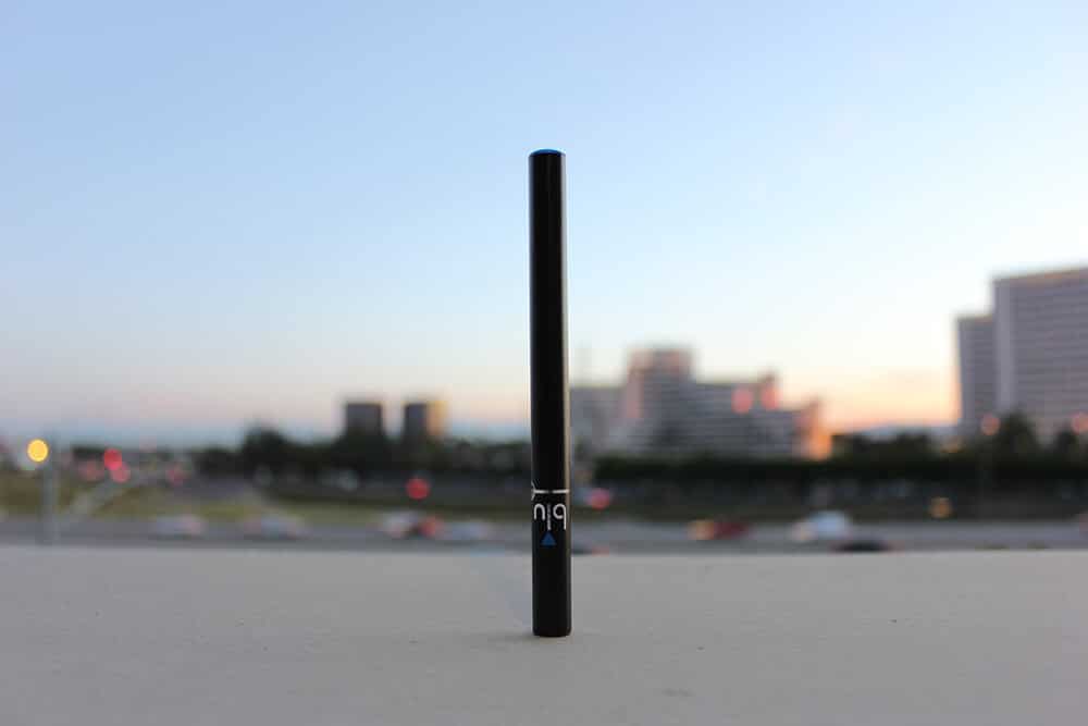 E-cigarette with city in the background