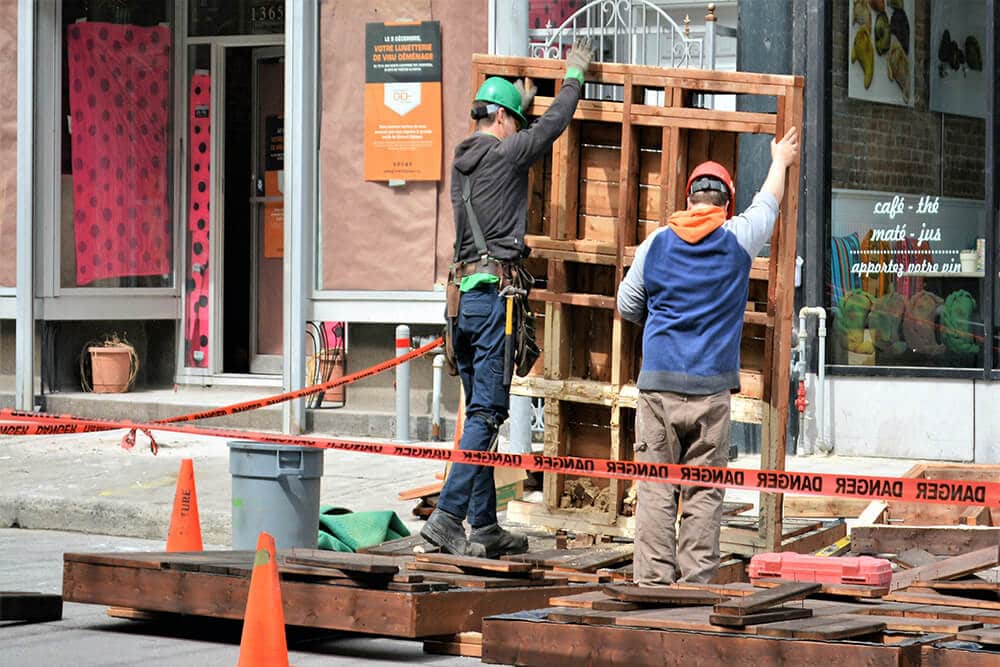 Two construction workers on a worksite